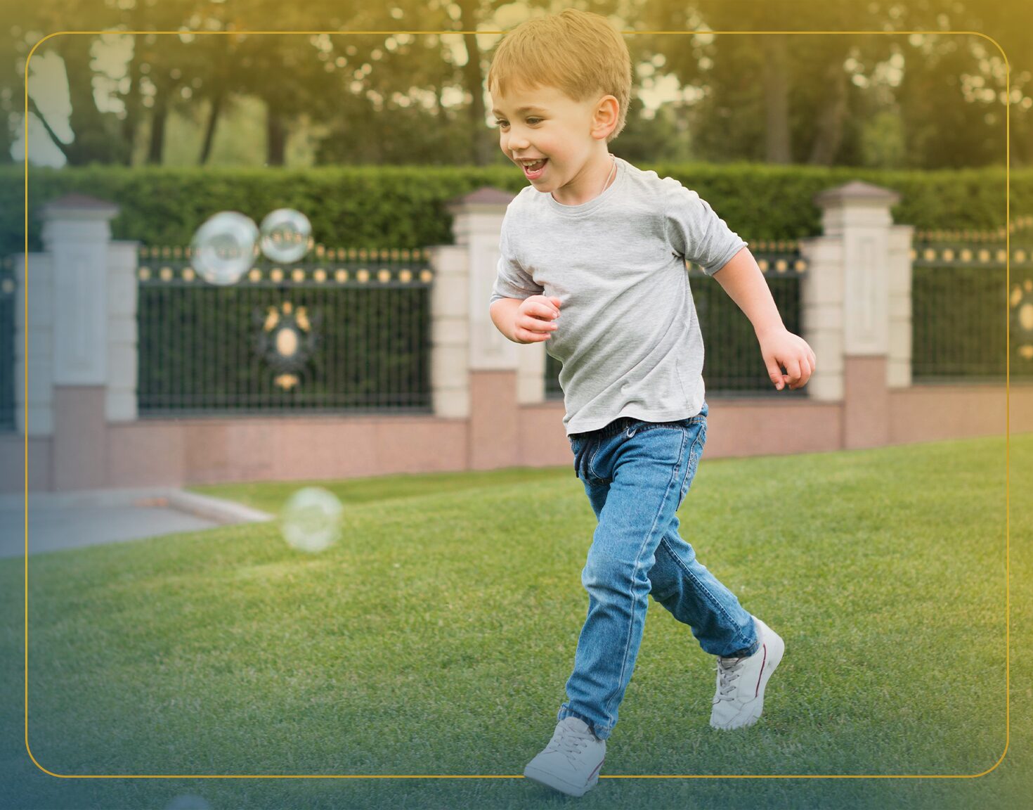 A young girl jumps off a dock into a lake, arms raised in excitement.