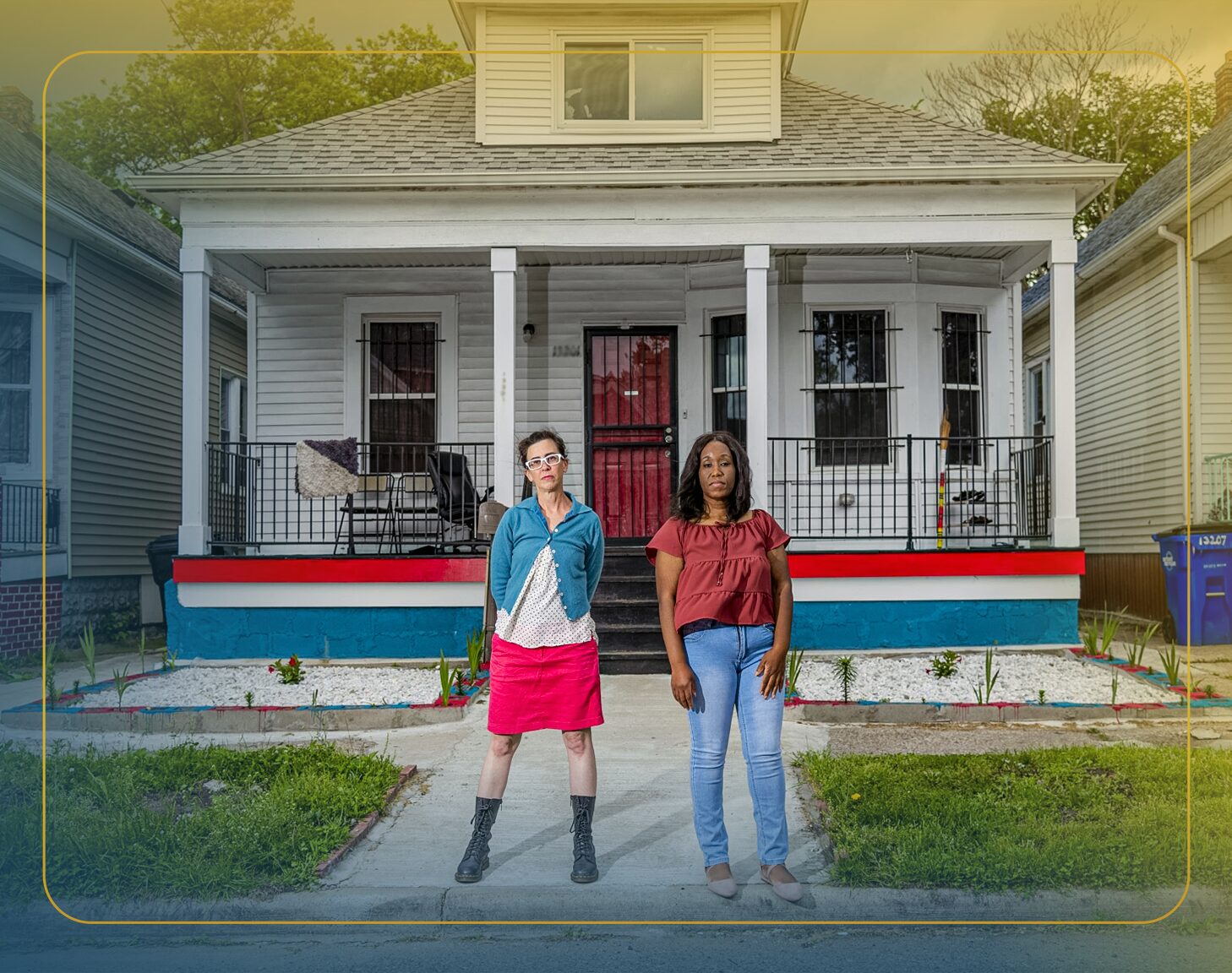 A mother holds a toddler on her hip while looking at the new house they bought with Redfin and Rocket Mortgage.